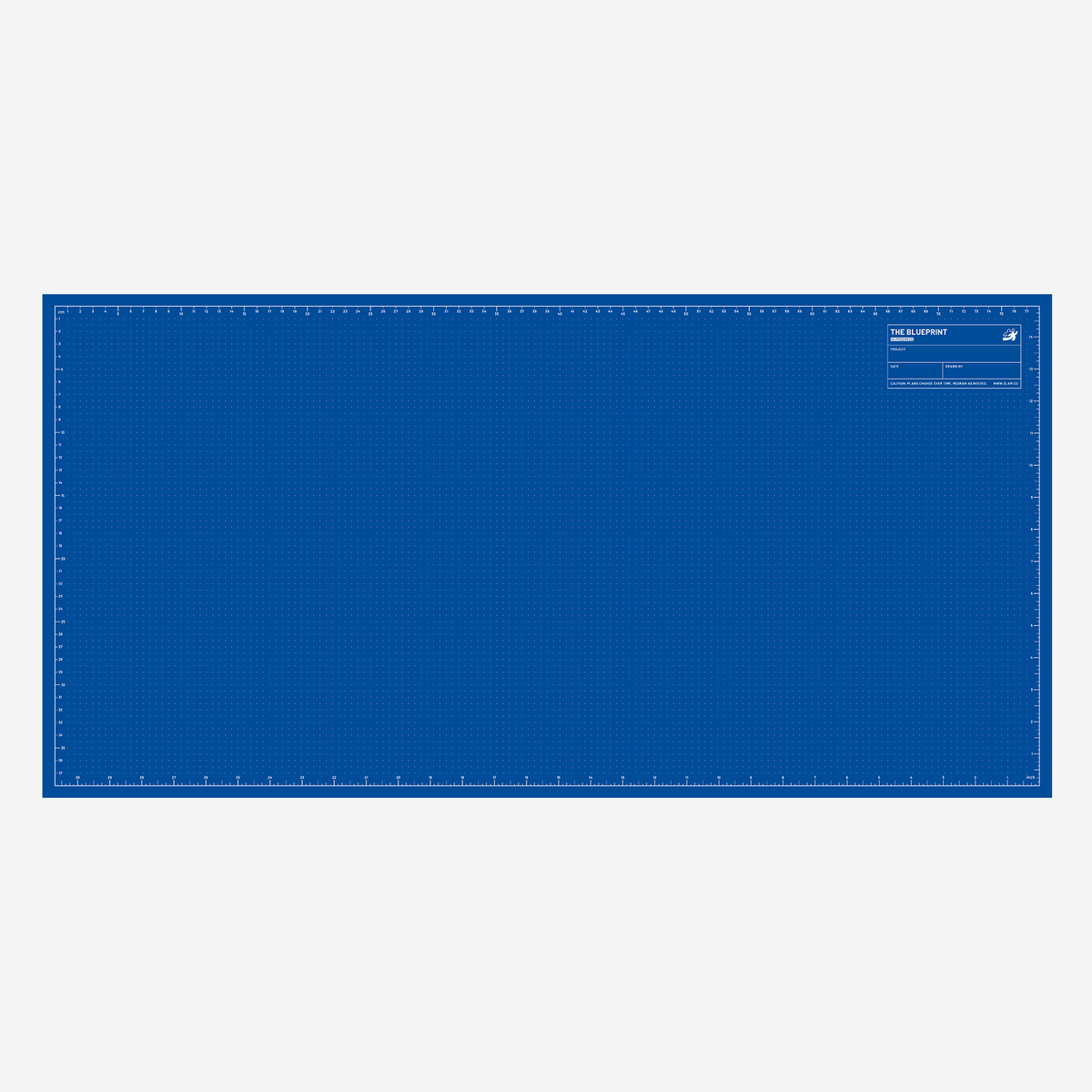 Blue side of the mat with dot grid and rulers